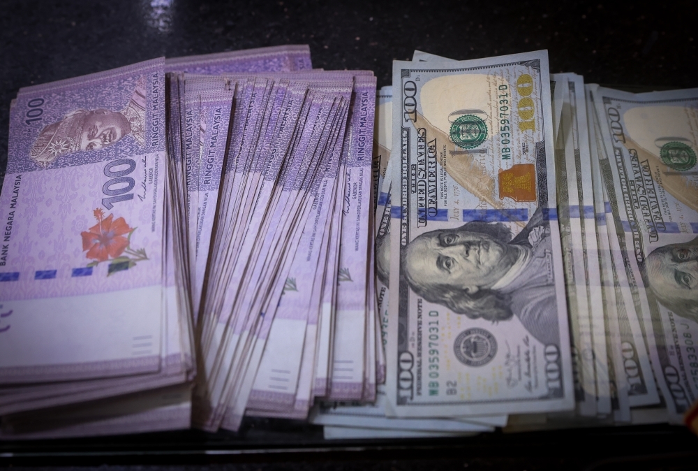 Ringgit slips against US dollar as new tariffs take effect despite reduced rate