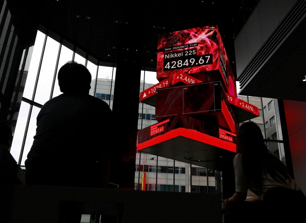 Soft US inflation lifts Asian stocks; Nikkei hits fresh record