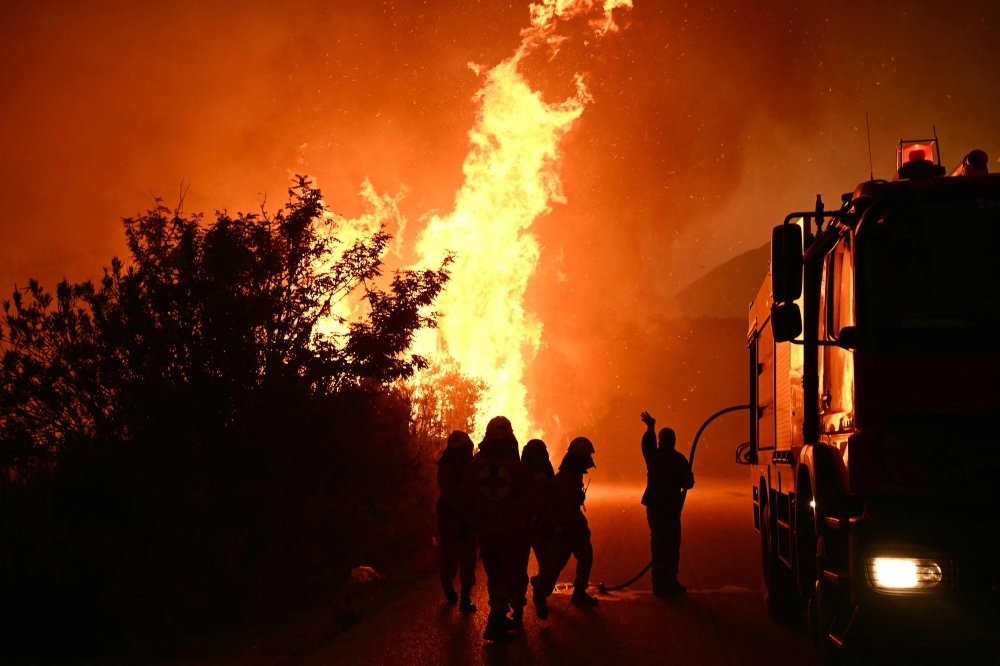 Wildfires rage across Greece and southern Europe amid intense heatwave