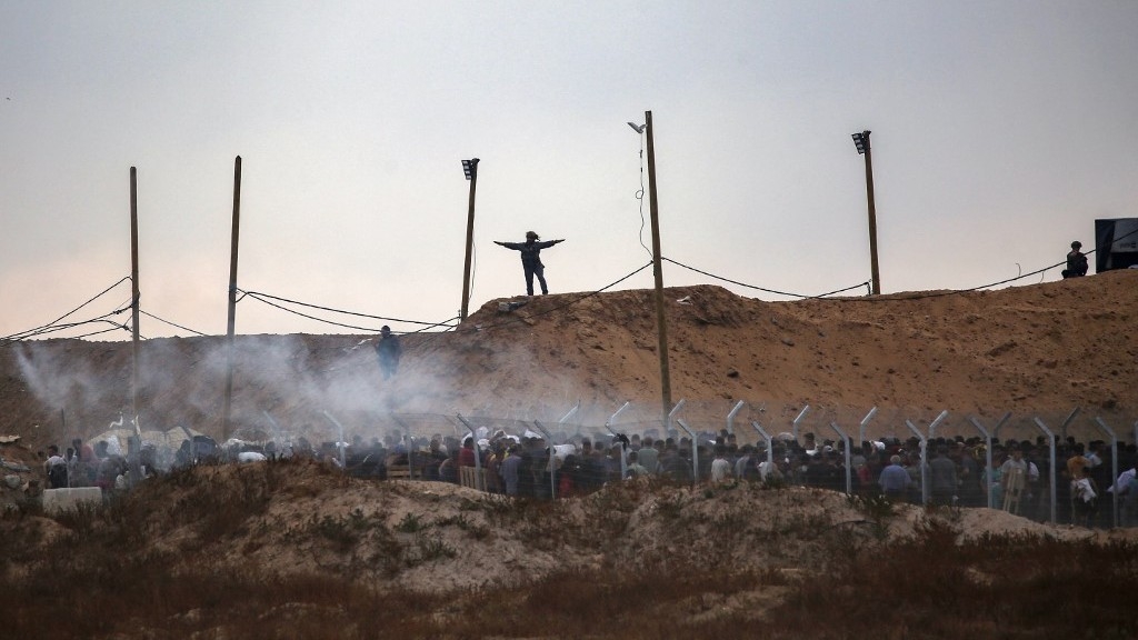 Live: Dozens killed and injured in Israeli shooting at aid site in Gaza