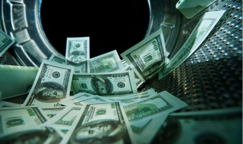 ‘Dirty money' ring linked to trafficking stands trial
