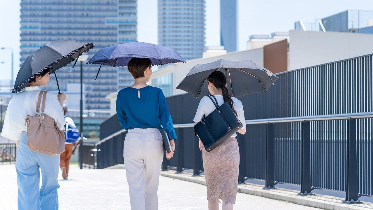 Men in Japan Turning to Parasols to Survive the Summer Heat