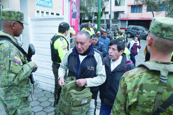 Ecuador votes in close presidential race, with violence the top concern
