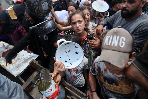 Gaza aid group halts distribution