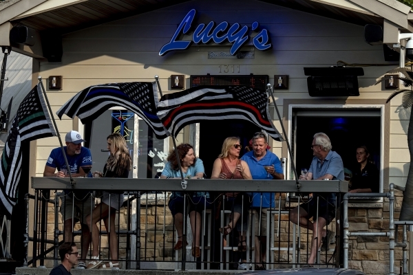 America's summer hot spots wonder: Will the vacationers still come?