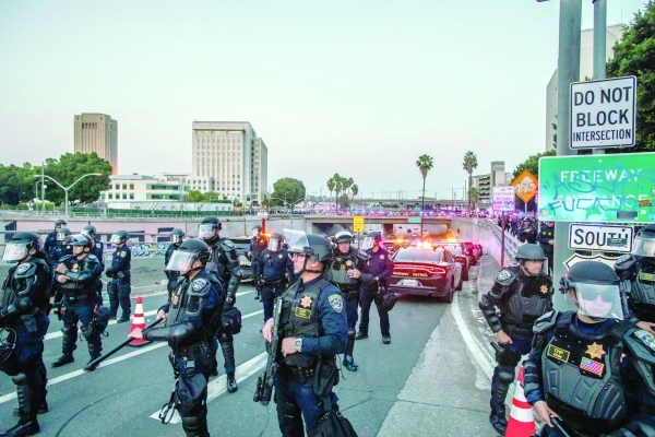 Police make arrests in downtown LA during nighttime curfew