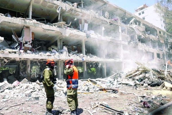 Loud explosions as Israel, Iran exchange massive strikes