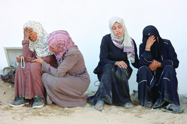 Spain PM alleges 'genocide' in Gaza as rescuers say 56 killed