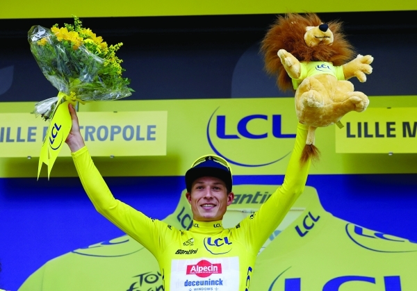 Philipsen wins windy Tour de France opener
