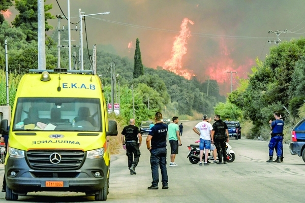 Thousands battle Greece fires as heatwave bakes Europe