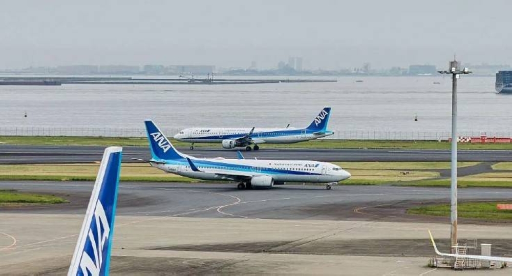 Japan flight from Tokyo to Texas makes emergency landing after passenger tried opening door