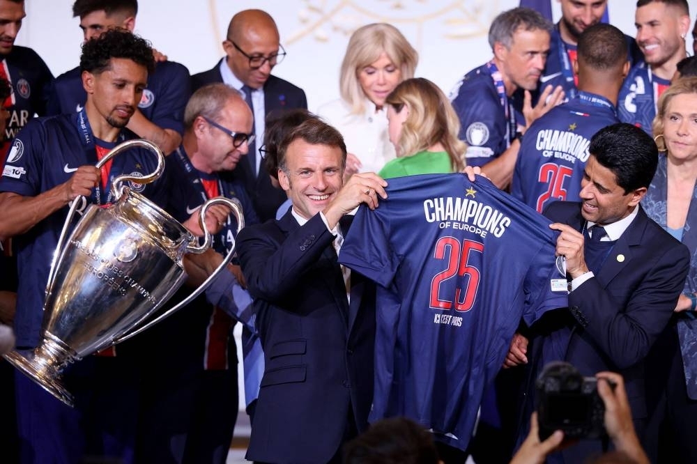 Macron congratulates PSG players after jubilant victory parade