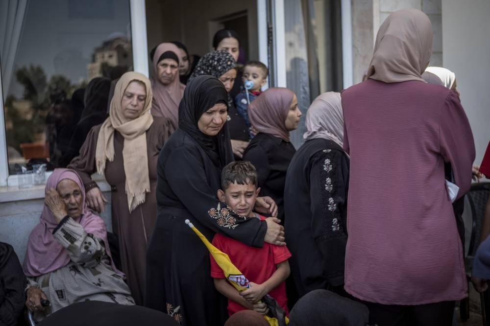 Israeli attacks kill 62 in Gaza, including three near aid site