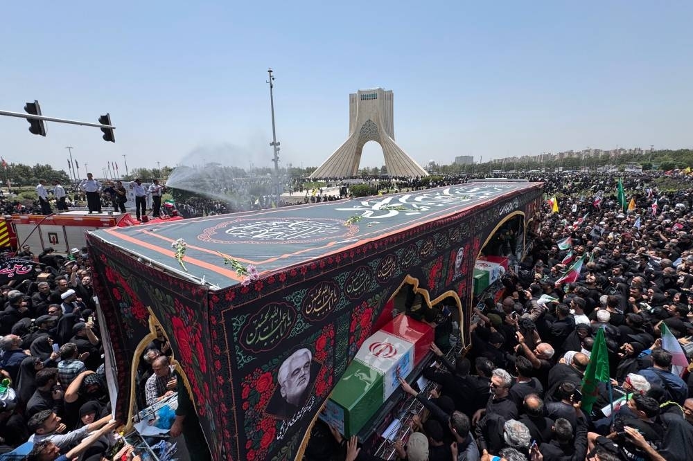 Tens of thousands of Iranians attend funerals of killed generals