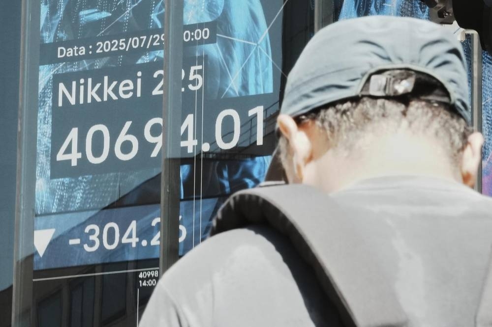 Asian shares mostly slip as focus shifts to US talks with China