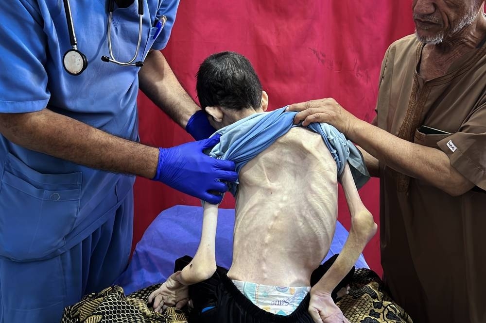 Dozens seeking food in Gaza killed as US envoy visits Israel