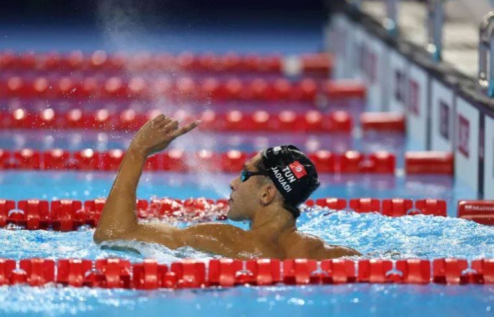 McIntosh and Marchand clinch medley doubles; Tunisian Jaouadi claims distance double