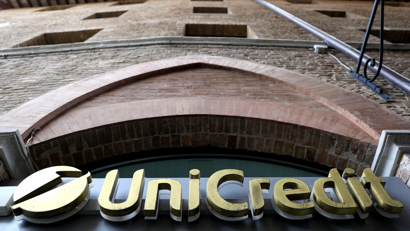 UniCredit raises profit outlook, says to be selective on deals