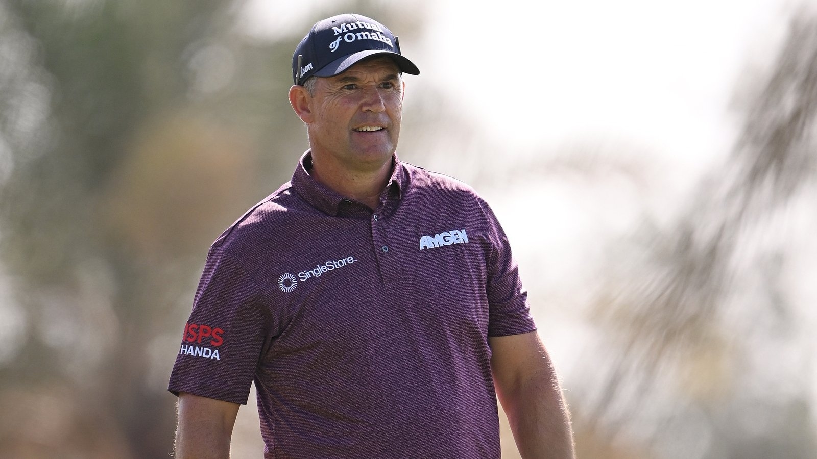 Pádraig Harrington clashes with on-course reporter but still shares US Open lead