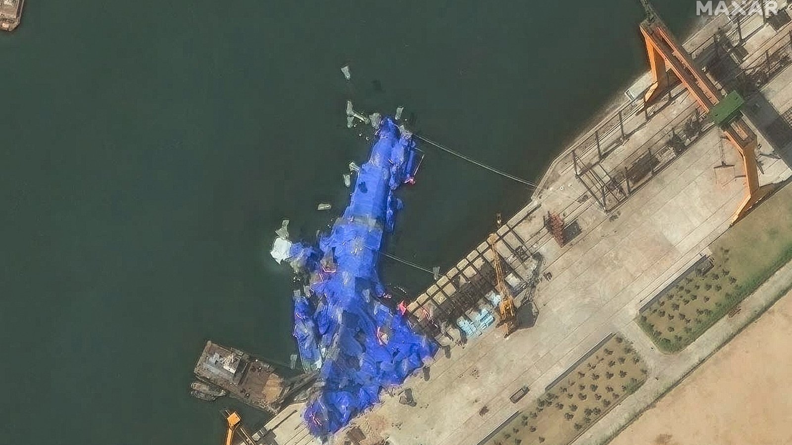 N Korea detains three over warship launch accident, says state media