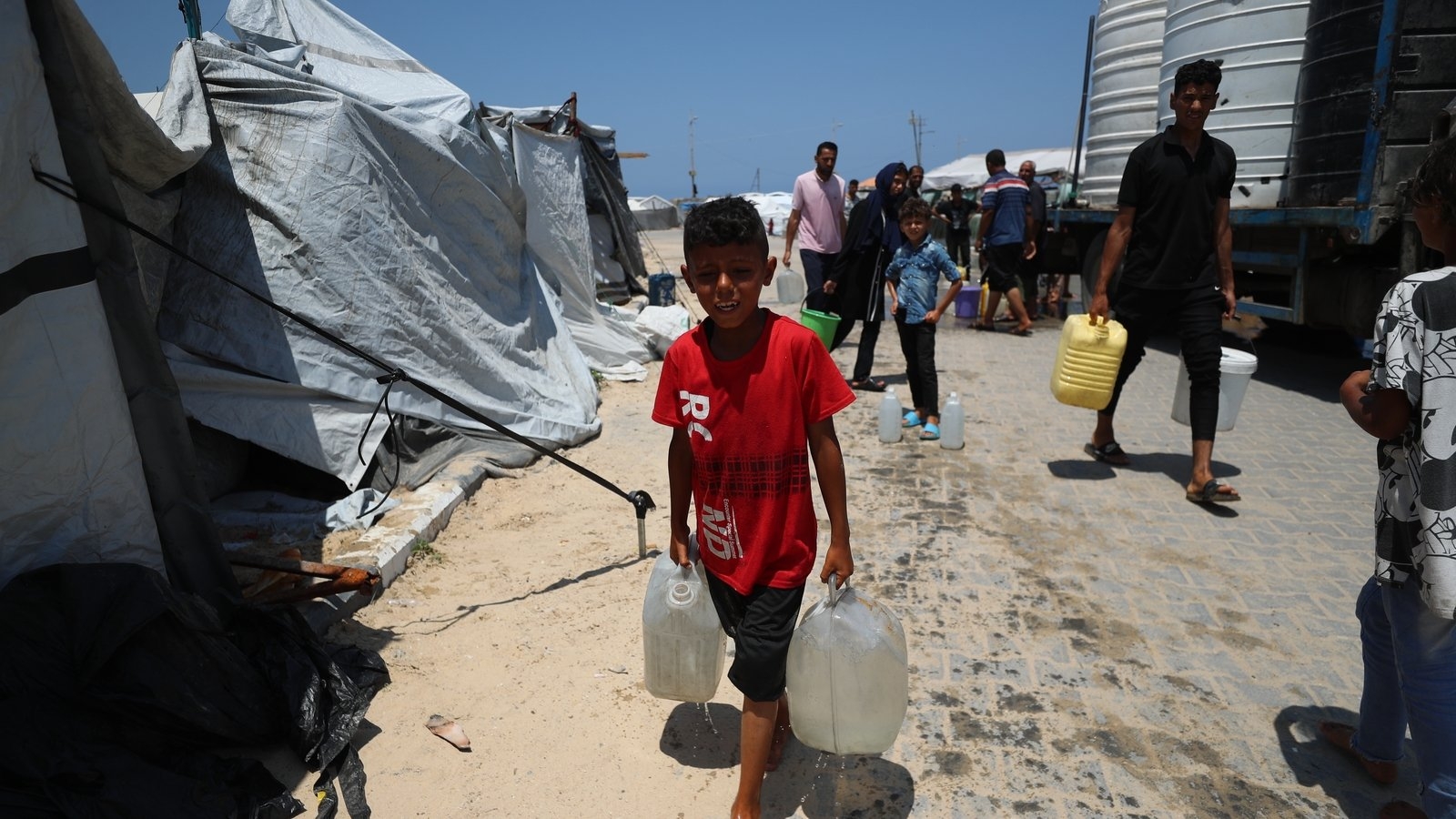 Israeli fire kills 60 in Gaza and many were near aid site, medics say