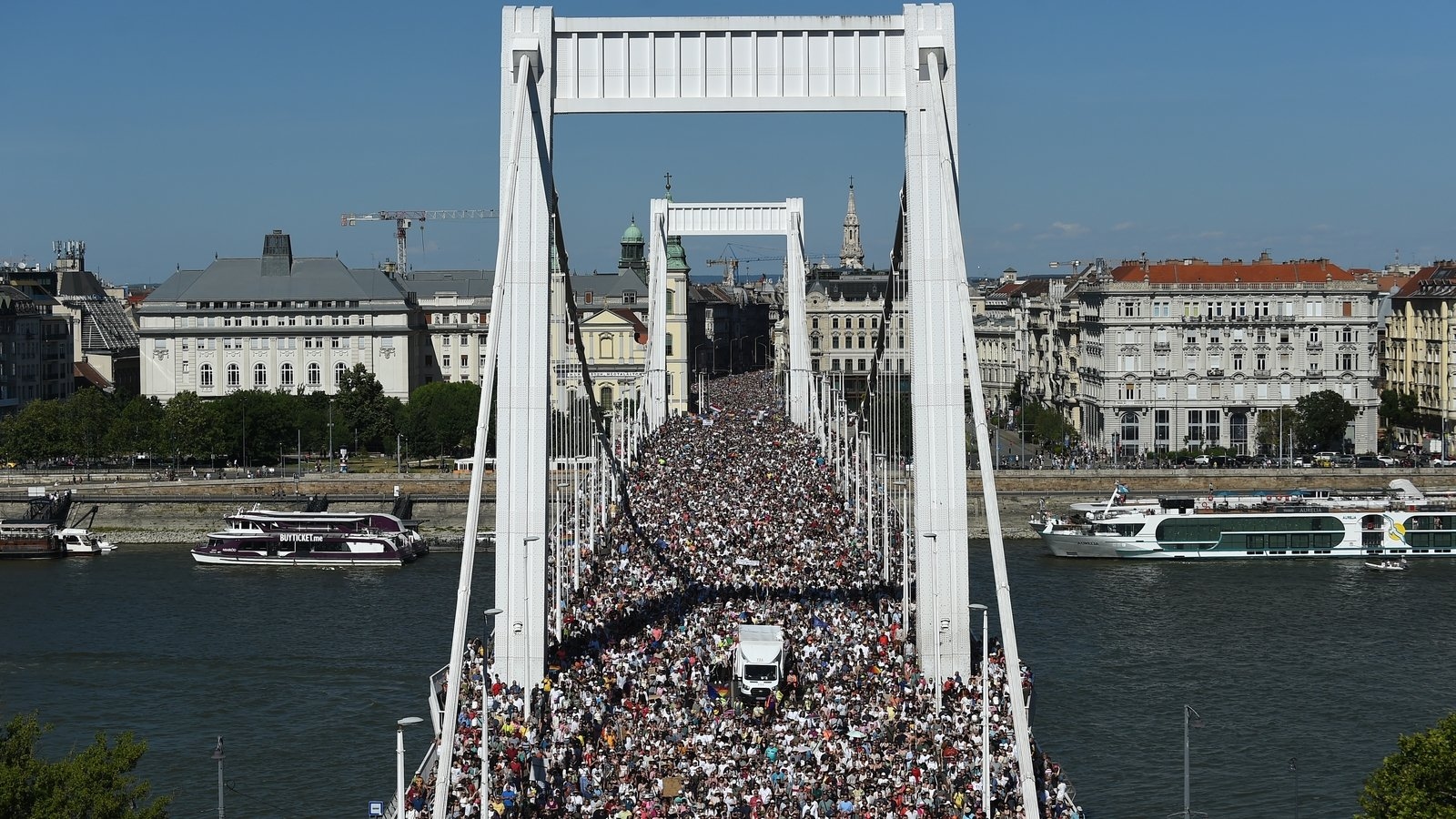 Thousands march in banned Budapest Pride parade in defiance of Orbán