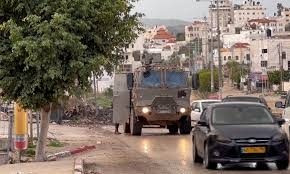 Zionist enemy forces launch raids on Al-Arroub Camp, Deir Qaddis, Turmus Ayya, & Kafr Malik near Ramallah
