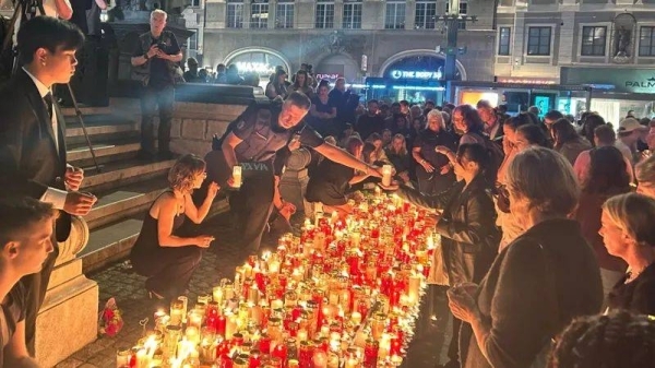 Austrians hold minute of silence and vigil for 10 victims of school shooting