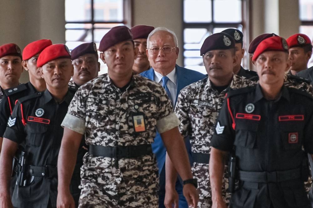 Najib's additional money laundering charges retained, trial continues