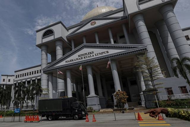 Two cops among four sentenced to 12 years jail, caning for RM1.1 million armed robbery
