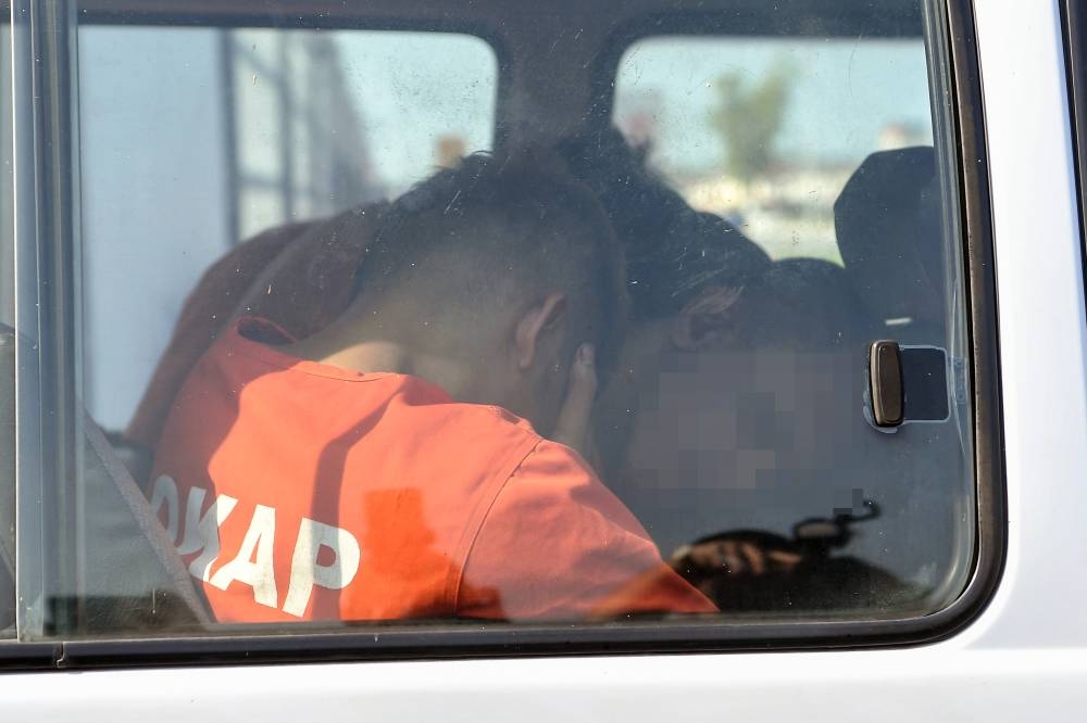 Four remanded for seven days over policeman's death