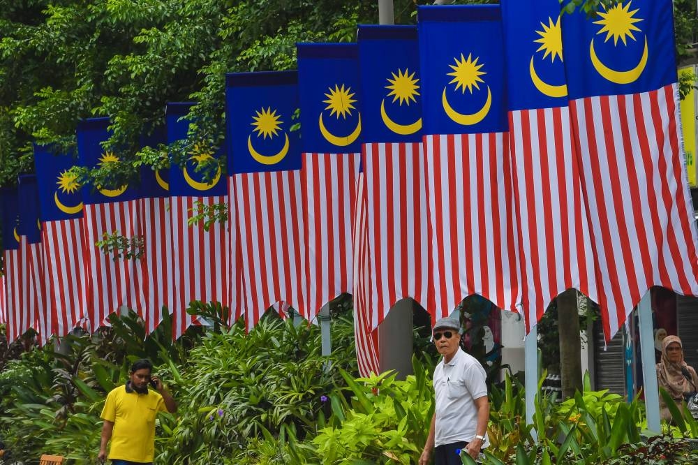 The Jalur Gemilang unites us, not divide