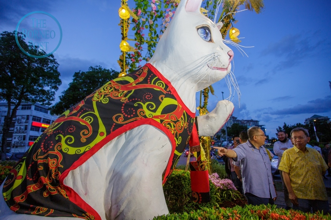 Kuching's iconic white cat statue dons Orang Ulu attire for Gawai Dayak