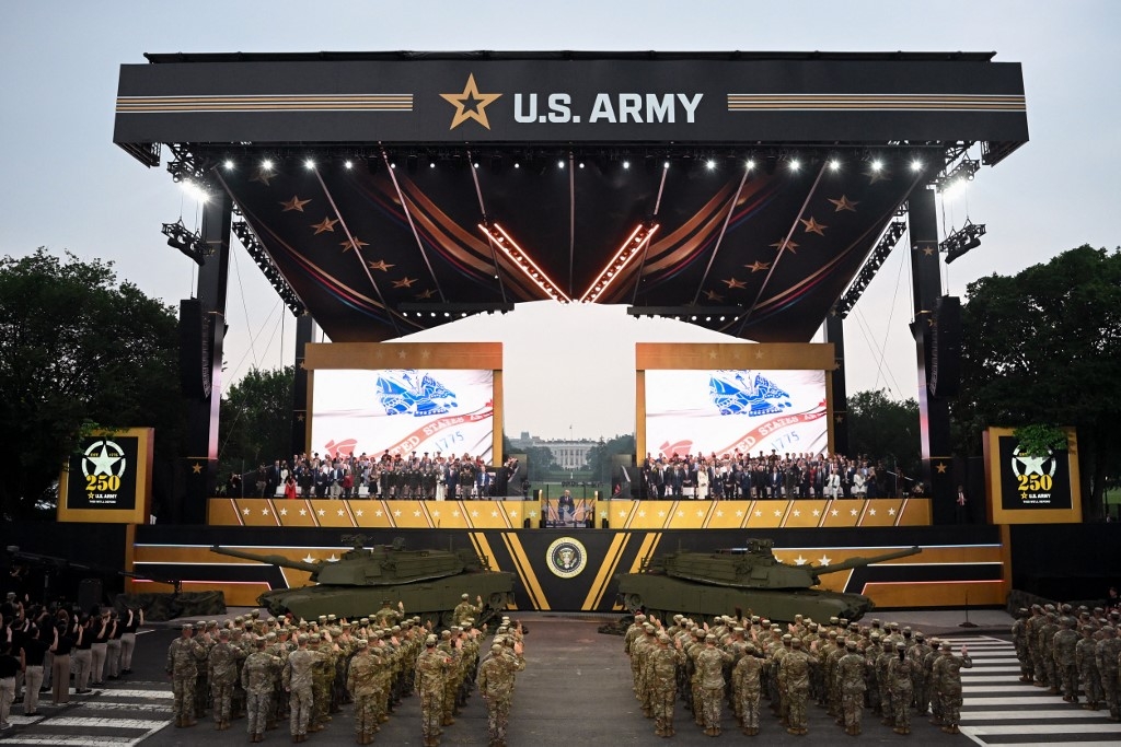 Trump flexes military might at parade as protests sweep US