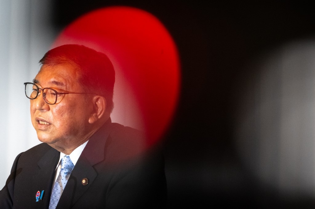 Japan PM hangs on after election debacle