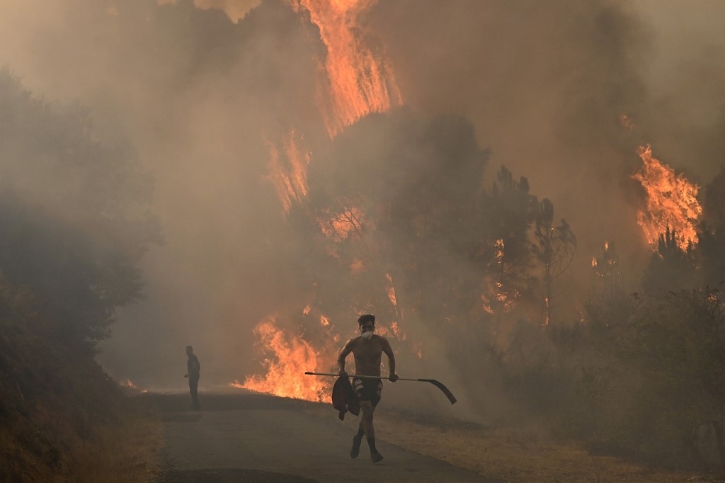 Spain suffers third wildfire death, Greece beats back flames