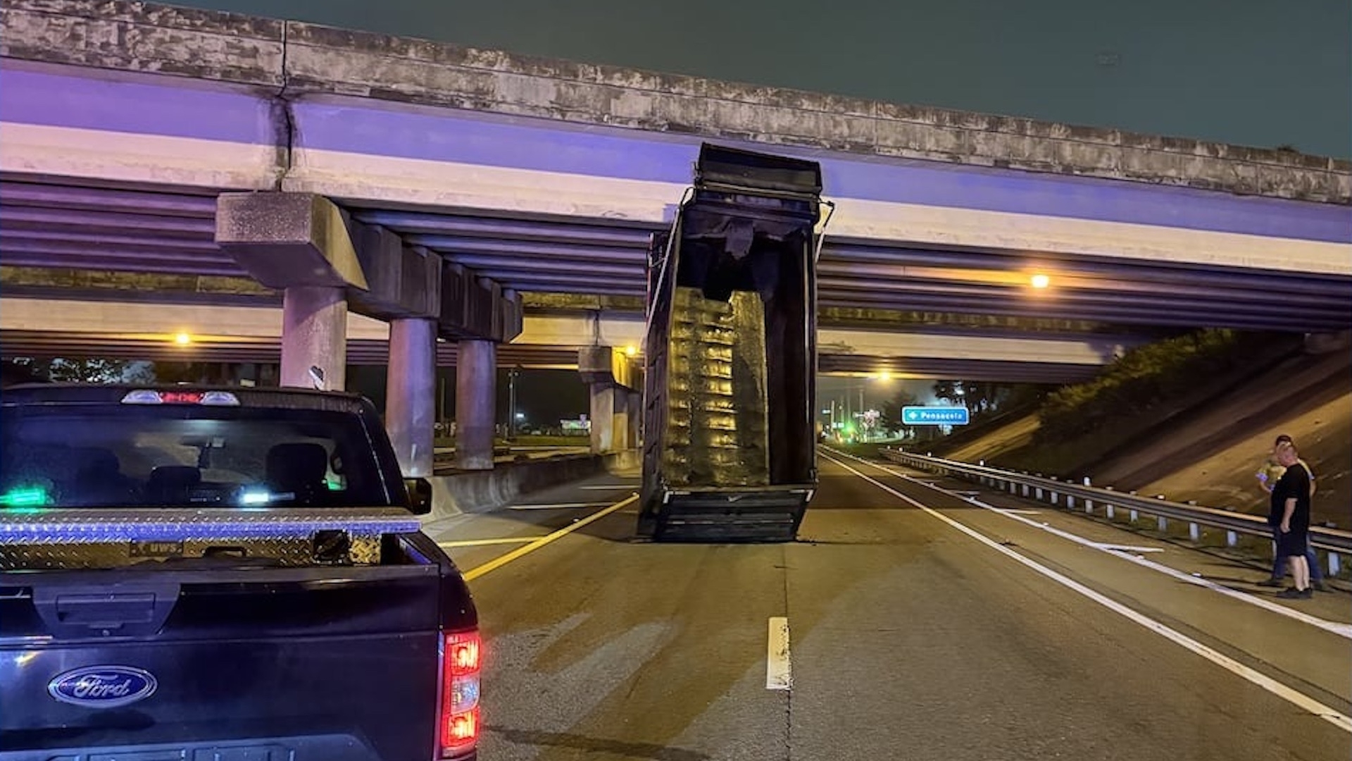 Driver Wedges Dump Truck Under Highway Overpass After Forgetting to Lower Its Bed
