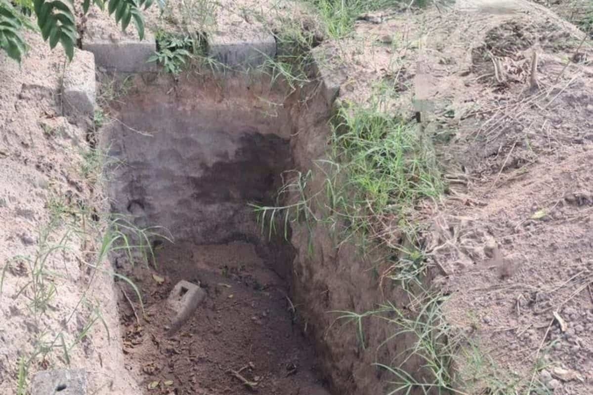Man found sleeping next to dug-up relatives' bones