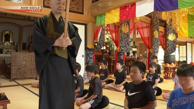 Children meditate, chant sutras at Buddhist temple in central Japan