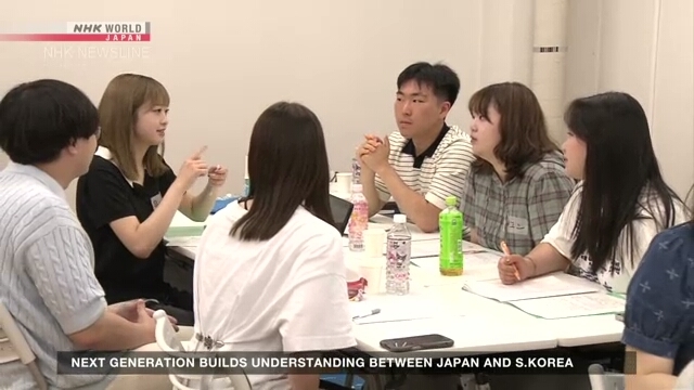 Students from Japan and South Korea build bridges