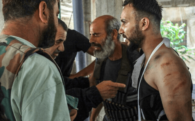 How gunmen in military uniform killed unarmed Druze: One hand on the gun, another on the camera
